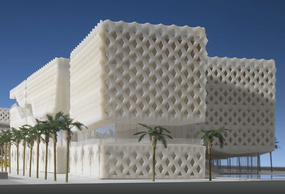 A modern building with a unique geometric facade, featuring overlapping grid patterns and surrounded by palm trees under a clear blue sky, seamlessly integrates 3D printing technology.