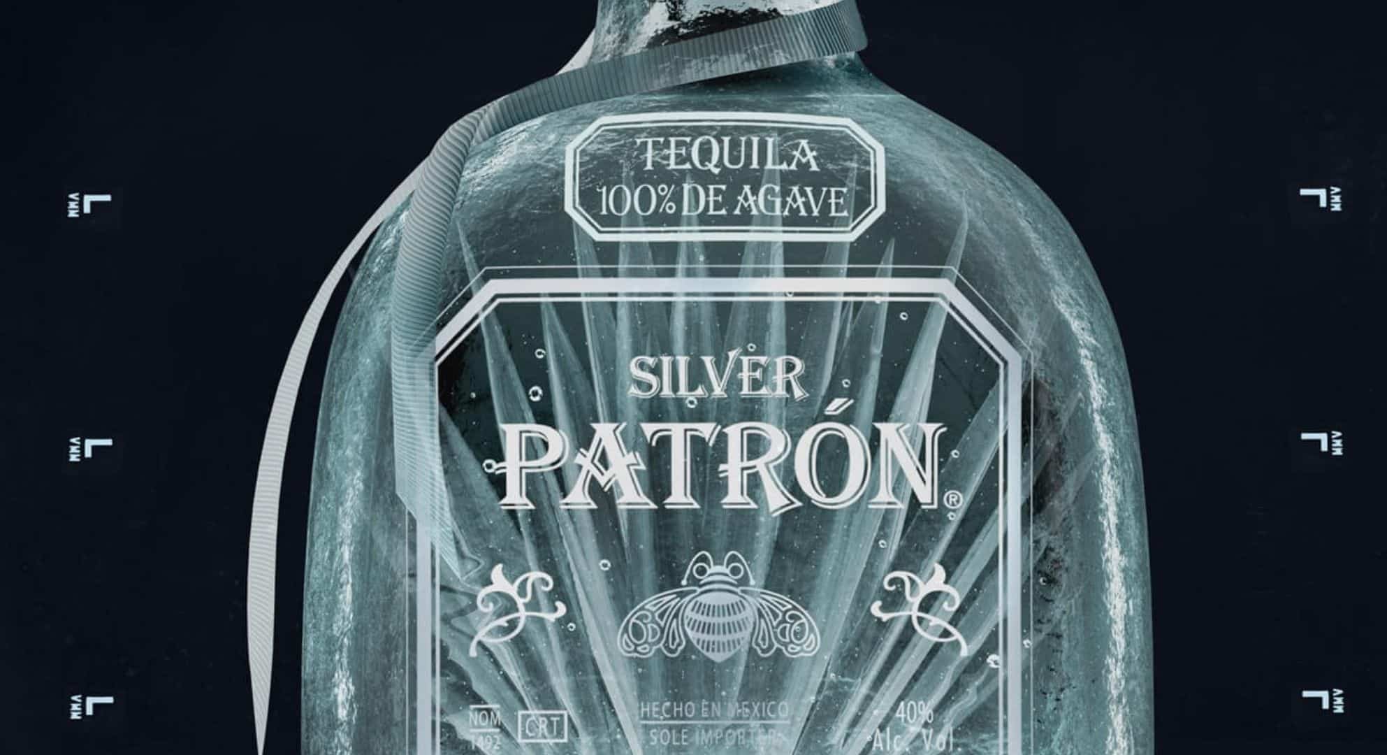 A close-up of a frosty bottle of Patrón Silver Tequila, labeled 