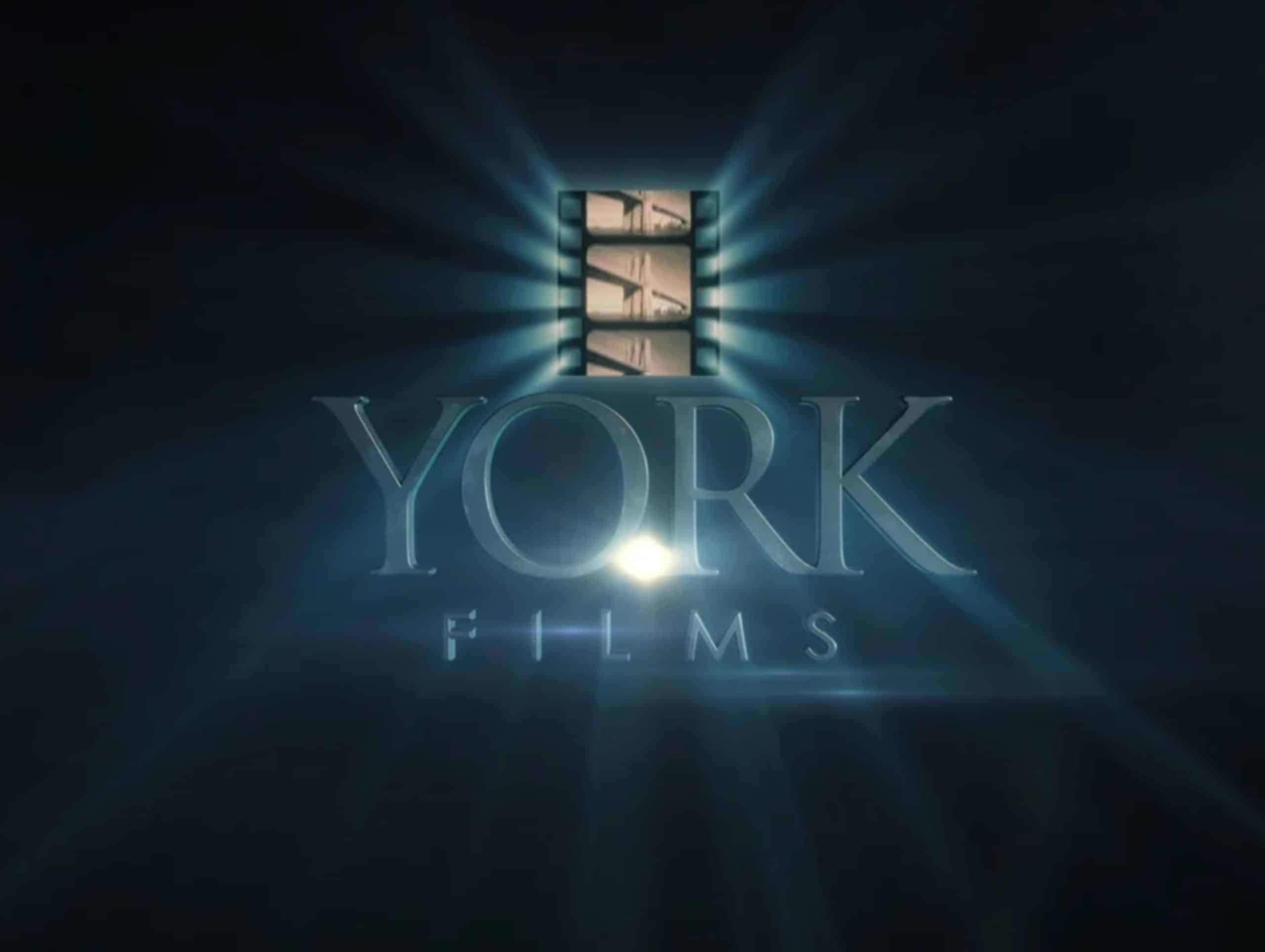 Logo for York Films featuring a stylized film strip and text illuminated by a spotlight, designed to shine whether used in small format printing or large format printing.