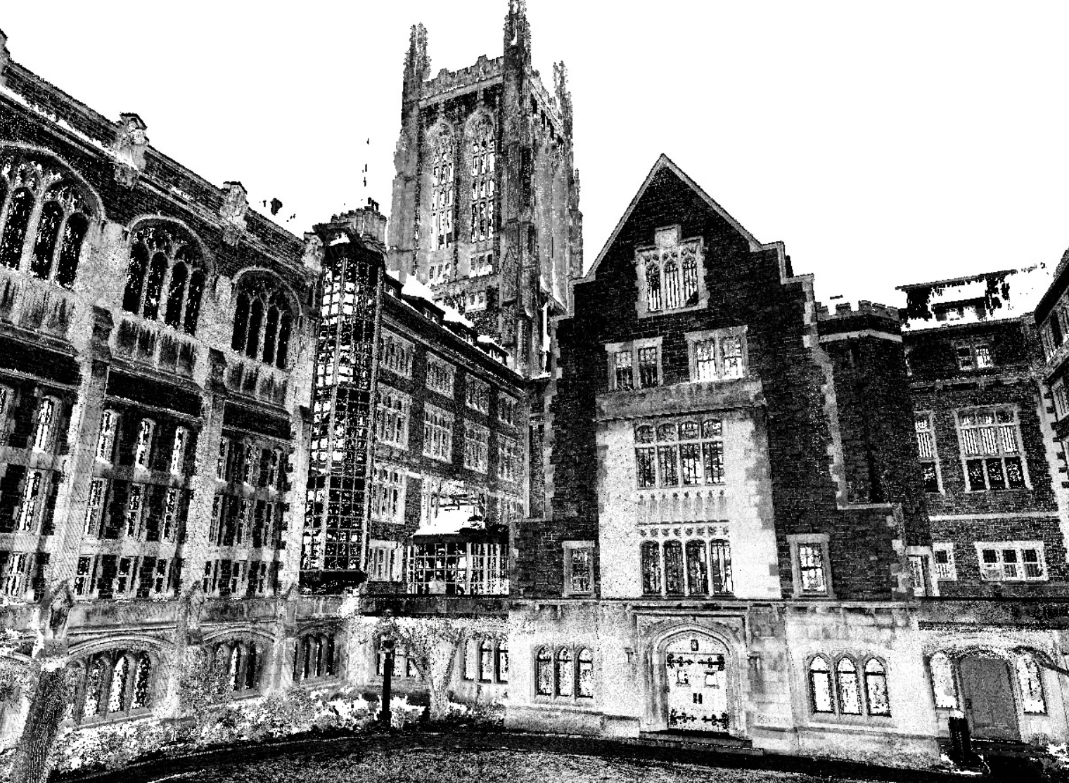 A black-and-white image of a gothic-style university building with tall windows, an ornate facade, and a towering bell tower in the background, perfect for large format printing to capture every intricate detail.