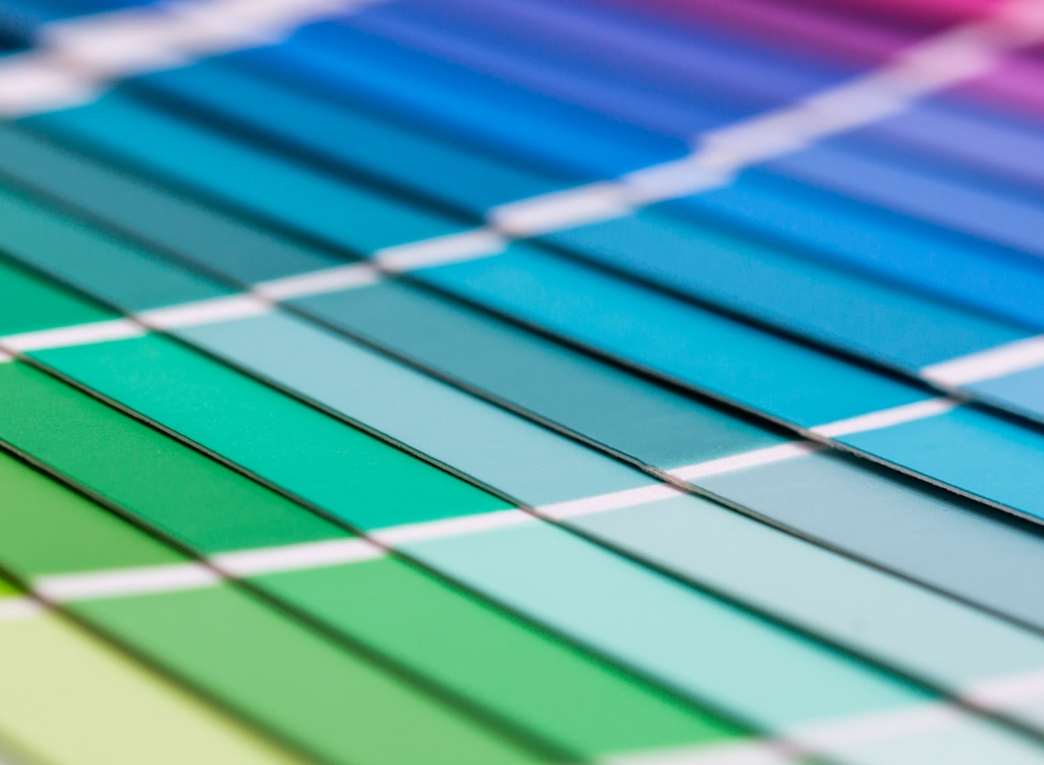 Close-up of a color palette showing a gradient from green to blue with adjacent color swatches separated by white lines, perfect for large format printing projects.