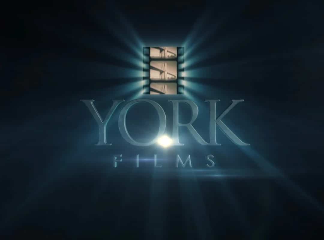 York Films logo featuring stylized text with a film strip icon above, illuminated by light rays, perfect for both small format printing and large format printing needs.