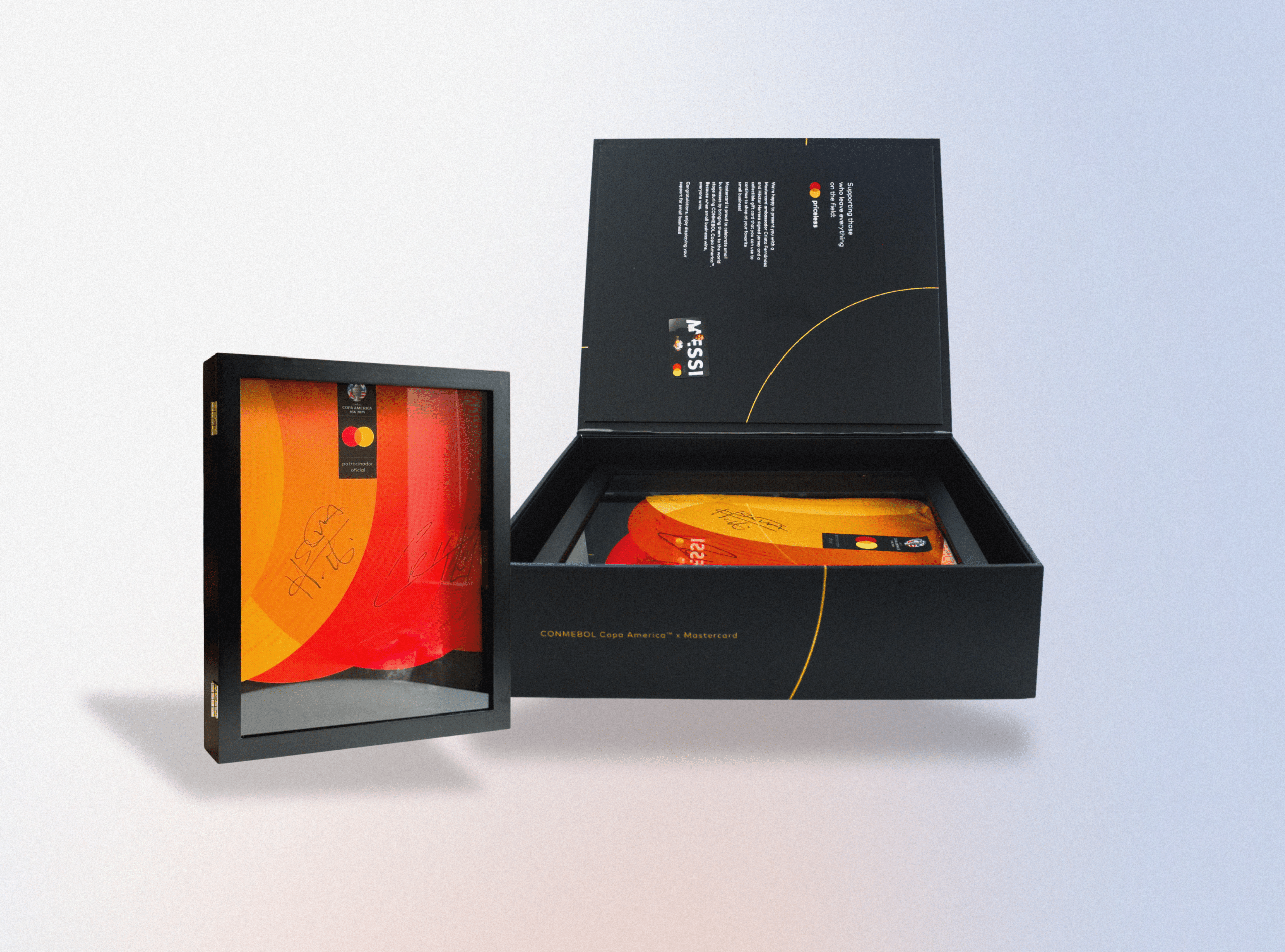 A box set featuring a signed black and orange football boot is displayed. One boot, crafted with precision akin to 3D printing services, is enclosed in a separate black case with a transparent cover.